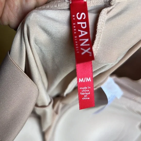 SPANX suit your fancy body suit.